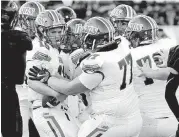  ?? THE OKLAHOMAN] [PHOTO BY STEVE SISNEY, ?? Moore’s Joe Balak celebrates a touchdown earlier this season. Moore travels to Jenks this week to open the playoffs for the first time since 2005.