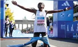  ?? Photograph: Tobias Schwarz/AFP/Getty Images ?? Ethiopia's Tigist Assefa celebrates after smashing the women's marathon world record by more than two minutes.