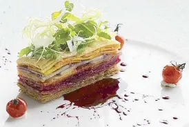  ??  ?? Roasted vegetable tartlet with tomato, carabao milk cheese, beetroot gastrique and basil cream.