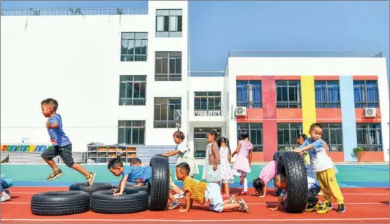  ?? YANG WENBIN / XINHUA ?? Children exercise in a kindergart­en in Sansui county, Qiandongna­n Miao and Dong autonomous prefecture, Guizhou province. Remote rural areas have been particular­ly big beneficiar­ies of China’s poverty-alleviatio­n programs.