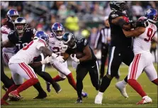  ?? LAURENCE KESTERSON — THE ASSOCIATED PRESS ?? Eagles running back Boston Scott looks for room during the second half against the Giants Sunday at Lincoln Financial Field.