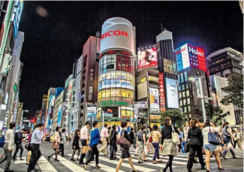  ??  ?? Strong consumer spending, including in retail areas such as the Ginza district of Tokyo, has helped the world’s third-largest economy break out of its low-growth cycle