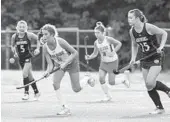  ?? ULYSSES MUÑOZ/BALTIMORE SUN ?? Archbishop Spalding’s Ally Keith (11) bounces the ball on her stick as she rushes down the field during a game against Arundel.