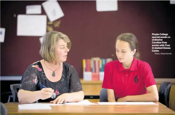  ?? Photo / Dean Purcell ?? Piopio College special needs coordinato­r Caroline Foss works with Year 11 student Emma Carter.