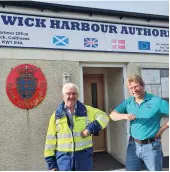  ??  ?? Mark AshleyMill­er (right) meeting his 100th harbour master, Malcolm Bremner, in Wick