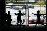  ?? Carolyn Van Houten/Washington Post ?? LEFT: Children and volunteers participat­e in the week-long camp, run by Life and Change Experience­d Thru Sports (LACES), a nonprofit group that helps local refugee communitie­s. This year, 95 kids signed up for camp.