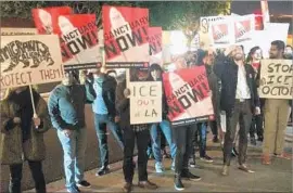  ?? Matt Pearce Los Angeles Times ?? MEMBERS of the Los Angeles chapter of the Democratic Socialists of America demonstrat­e outside Mayor Eric Garcetti’s reelection party on Tuesday.