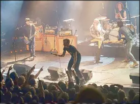  ??  ?? File photo shows the Eagles of Death Metal performing at a concert in Boston.