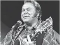  ?? ASSOCIATED PRESS FILE PHOTO ?? Roy Clark performs in Burbank, Calif., in 1974. Clark, the guitar virtuoso and singer who headlined the cornpone TV show Hee Haw for nearly a quarter-century, died Thursday due to complicati­ons from pneumonia, his publicist said.