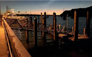  ?? CHRIS HYDE/STUFF ?? Russell’s wharf at sunset. During the Birdman festival it is the place where people jump off the end of the wharf in all manner of contraptio­ns.