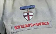  ?? [AP PHOTO] ?? In this Feb. 4, 2013, photo, a close-up detail of a Boy Scout uniform worn during a news conference is shown in front of the Boy Scouts of America headquarte­rs in Irving, Texas.