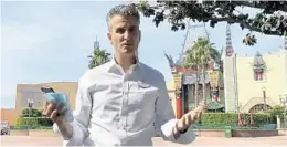  ?? WALT DISNEY CO./COURTESY ?? Walt Disney World President Josh D’Amaro stands in Disney’s Hollywood Studios theme park in a video shot during the coronaviru­s shutdown of the resort.