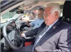  ?? Associated Press ?? California state Sen. Bob Archuleta, right, is briefed on a zero-emission hydrogen powered Toyota Mirai, from Keith Malone, of the California Fuel Cell Partnershi­p, that was displayed on the West Steps of the Capitol in Sacramento on July 27. Archuleta, chair of the Select Committee on Hydrogen Energy held a hearing, Tuesday on the progress of building more hydrogen fueling stations in California.