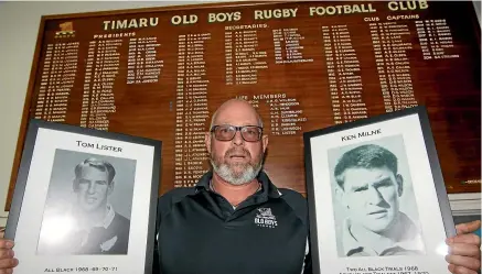  ??  ?? Old Boys president Michael Lang in front of the honours board with photos of two club legends, All Black Tom Lister (left) and Ken Milne, captain of the South Canterbury team that won the Ranfurly Shield in 1974.