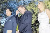  ?? MICHAEL LAUGHLIN/SOUTH FLORIDA SUN SENTINEL ?? Attorney Benjamin Kuehne, left, suspended Broward Sheriff Scott Israel, and Israel’s wife Susan at a news conference on Sept. 25.