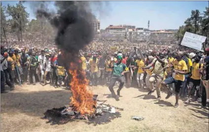  ??  ?? Burning issue: Students and supporters demonstrat­e during a #FeesMustFa­ll protest at the Union Buildings in 2015. The league has welcomed the ANC resolution but opposition parties are sceptical. Photo: Oupa Nkosi