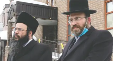  ?? Ryan REMIORZ / THE CANADIAN PRESS ?? Abraham Ekstein, left, and Max Lieberman of the Hasidic Jewish Council of Quebec speak to the media on Friday in Montreal.