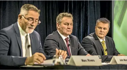  ?? JASON DORDAY/STUFF ?? In its 17-year history, Fonterra has never experience­d an annual loss before. Delivering the bad news at yesterday’s results presentati­on are, from left, chief financial officer Marc Rivers, chairman John Monaghan, and chief executive Miles Hurrell.