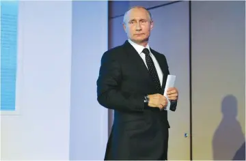  ?? (Alexi Druzhinin/Kremlin/Sputnik/Reuters) ?? RUSSIAN PRESIDENT Vladimir Putin attends an investment forum in Moscow yesterday.