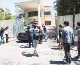  ??  ?? Malaysian health minister said the dose of VX given to Kim was so high that he showed symptoms within minutes.
POISONED. Journalist­s follow a car entering the North Korean Embassy in Kuala Lumpur, Malaysia. /