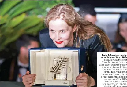  ?? Xinhua ?? French female director wins Palme d’Or at 76th Cannes Film Festival French director Justine Triet poses with the trophy during a photocall after she won the Palme d’Or for the film “Anatomie d’une Chute” (Anatomy of a Fall) during the closing ceremony of the 76th edition of the Cannes Film Festival in Cannes, southern France.