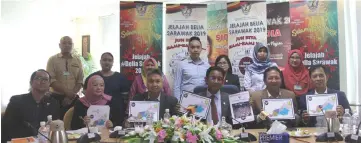  ??  ?? Abdul Karim (seated third right) and Snowdan on his right and other officers hold the banner to promote the event.