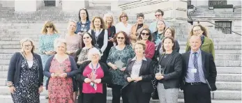  ?? ?? The long service award recipients on Guildhall steps.