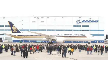  ??  ?? A Boeing 787-10 Dreamliner sits on the tarmac as people gather for a delivery ceremony to Singapore Airlines at the Boeing South Carolina Plant in North Charleston, South Carolina, United States March 25. — Reuters photo