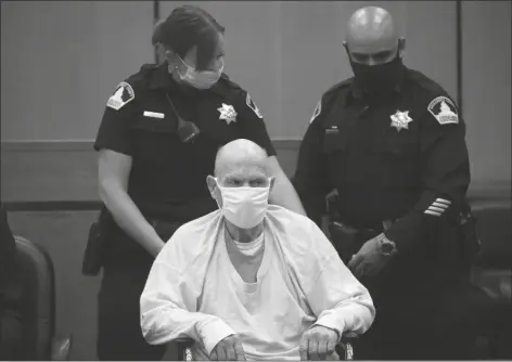  ?? ASSOCIATED PRESS ?? JOSEPH JAMES DEANGELO, SITTING IN A WHEELCHAIR, is brought out of the courtroom for a break in the schedule for the third day of victim impact statements at the Gordon D. Schaber Sacramento County Courthouse on Thursday in Sacramento, Calif. DeAngelo, 74, a former police officer in California, eluded capture for four decades before being identified as the Golden State Killer.