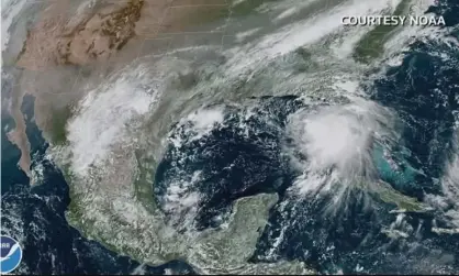  ?? Photograph: Reuters Tv/Reuters ?? A satellite image of Hurricane Sally as a tropical storm in the Gulf of Mexico.