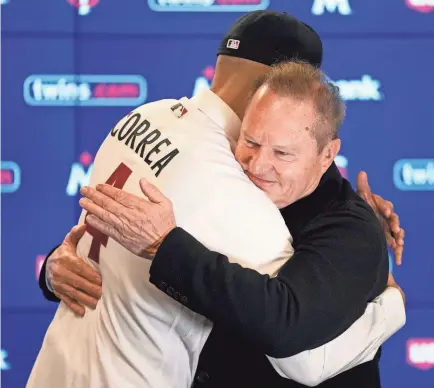  ?? ABBIE PARR/AP ?? Carlos Correa and Scott Boras hug at the shortstop’s press conference last week in Minneapoli­s.