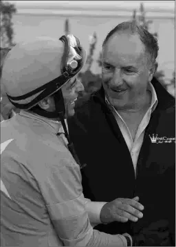  ?? BENOIT PHOTO ?? Richard Baltas (right) is well stocked for the Santa Anita meet.