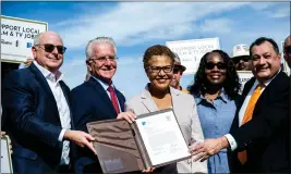  ?? SARAH REINGEWIRT­Z — STAFF PHOTOGRAPH­ER ?? CEO Michael Hackman, of Hackman Capital Partners who owns Radford Studio Center, City Council President Paul Krekorian, Mayor Karen Bass, President Yvonne Wheeler, of the Los Angeles Federation of Labor, and Ex. Sec. Ernesto Medrano, of Los Angeles/ Orange Counties Building & Constructi­on Trades Council, pose after Hackman and Medrano signed a project labor agreement for Radford Studio Center's modernizat­ion and expansion plan on Tuesday. Bass said the studio can help the local economy.