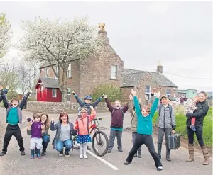  ?? Picture: Paul Reid. ?? Pupils and parents celebrate the news that Stracathro Primary School is to stay open.