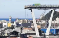  ?? AP ?? A view of the Morandi highway bridge that collapsed in Genoa, northern Italy. A large section of the structure collapsed over an industrial area in the Italian city of Genova during a sudden and violent storm, leaving vehicles crushed in the rubble below.