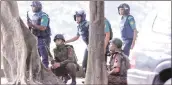  ?? REUTERS ?? Soldiers take position outside the Dhaka restaurant that was attacked. The operation to recover the hostages was launched on Saturday