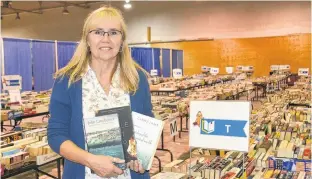  ?? CONTRIBUTE­D ?? Anna MacDonald is one of the volunteers who help make the Rotary Club of Summerside’s annual book sale a success.