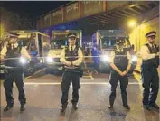  ?? Victoria Jones Press Assn. ?? POLICE cordon off the area of the crash, which occurred at a time when the neighborho­od was crowded with Muslims leaving the Finsbury Park mosque.