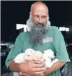  ?? Photos: FAIRFAX NZ ?? Puppy love: Rowan Hargreaves with three surviving pups.