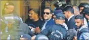  ?? REUTERS ?? Police escort Pakistan's former PM Imran Khan, as he appeared in Islamabad High Court on May 12, 2023.