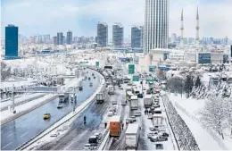  ?? EMRAH GUREL/AP ?? Hundreds of vehicles block a main road Tuesday in Istanbul. More than 31 inches of snow fell in some parts of Turkey. Greece was also slammed with a winter storm.