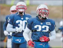  ?? STEVEN SENNE/AP PHOTO ?? New England Patriots free safety Devin McCourty, front, and his brother cornerback Jason McCourty, left, warm up during practice on Wednesday at Foxborough, Mass.