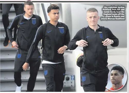  ??  ?? On a mission: Jordan Pickford, Dele Alli and Jamie Vardy lead the England team off the
plane in Russia and (inset) Marcus Rashford