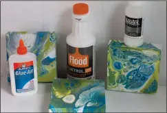  ?? AP Photo/Holly Ramer ?? Shown here are three different mediums – Elmer’s glue, Floetrol paint additive and Liquitex pouring medium – and the resulting art on canvas made by mixing them together in Hopkinton, N.H. Pouring paint directly on a canvas is an easy way to create...