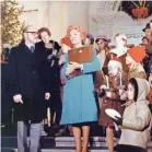  ?? PROVIDED BY RICHARD NIXON FOUNDATION ?? First lady Pat Nixon greets candle lighters on the steps of the North Portico during a candleligh­t tour in 1972. The first lady used Christmas to make the White House more visible and accessible.