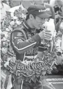  ?? ASSOCIATED PRESS ?? Driver Takuma Sato, a driver for owner Michael Andretti, toasts with with bottles of milk after Sato’s 2017 Indianapol­is 500 victory.