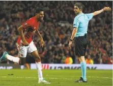  ?? Dave Thompson / Associated Press ?? Manchester United’s Marcus Rashford (left) celebrates his goal in extra time in a Europa League quarterfin­al win.