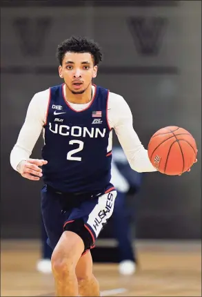  ?? Matt Slocum / Associated Press ?? UConn’s James Bouknight dribbles against Villanova during Saturday’s 68-60 loss in Villanova, Pa.