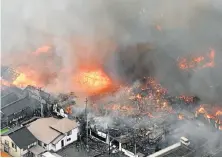  ?? Picture: REUTERS ?? RUNAWAY BLAZE: Fire engulfs houses and shops in Japan