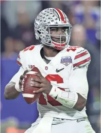  ?? MATTHEW EMMONS, USA TODAY SPORTS ?? J.T. Barrett, with 69 career touchdown passes and 21 intercepti­ons, aims to lead Ohio State to a perfect season.